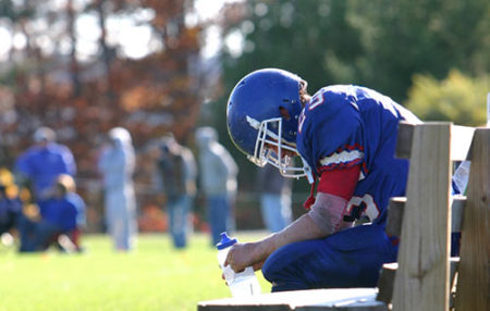 Football Player on Bench