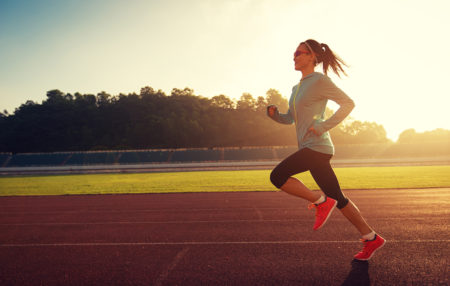 woman running track