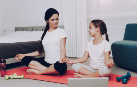 2 women doing yoga