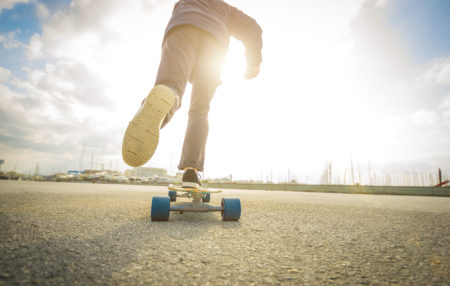 person kicking off on a skateboard