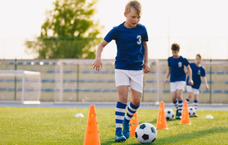 children doing soccer drills