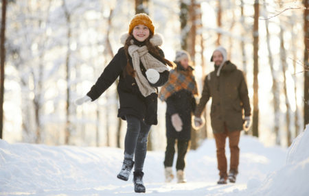 child running through the snow