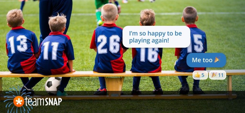 soccer players sitting on a bench 