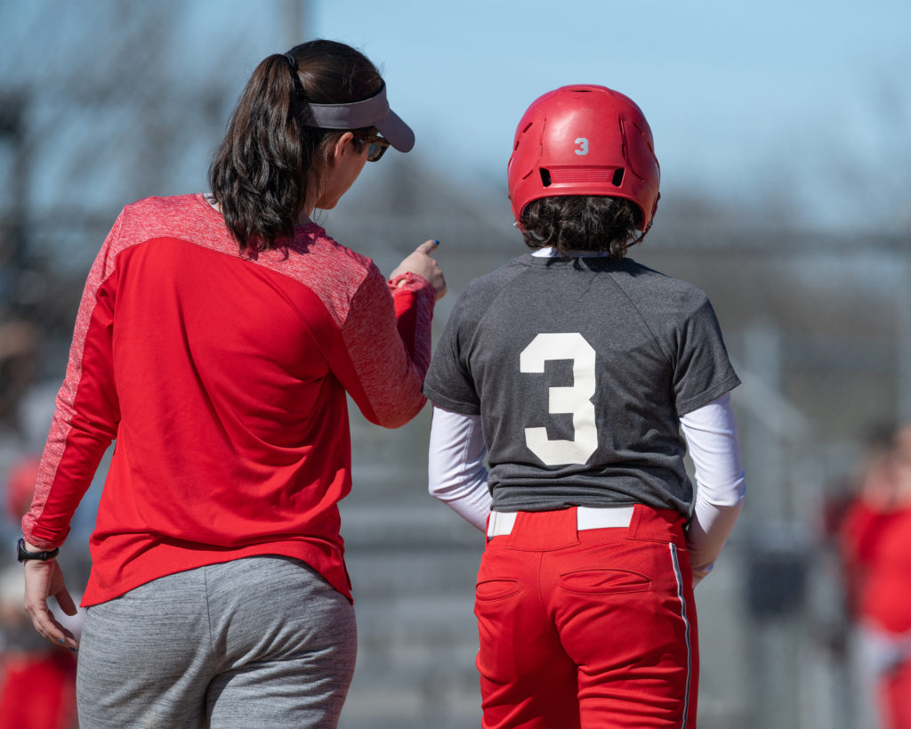 coach giving a player feedback