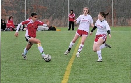 Celia, playing soccer on the field